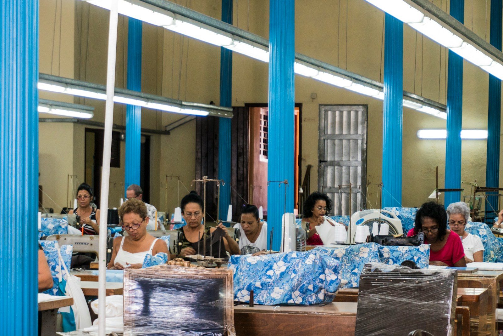 people sitting on chair in front of table, manufacture